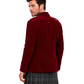 A man shown from the back wearing a deep burgundy velvet blazer over a gray and black plaid kilt, photographed against a solid white background.
