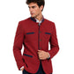 A man wearing red blazer with dark blue accents on white background