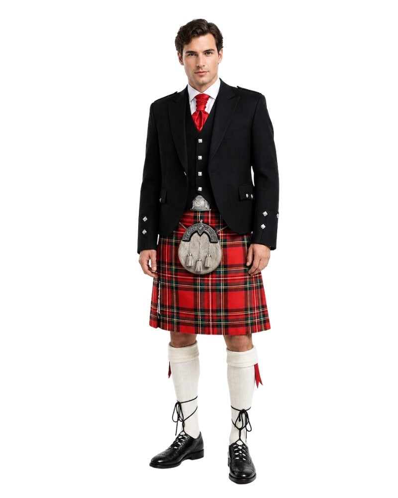 Man wearing a traditional Scottish kilt with a white background