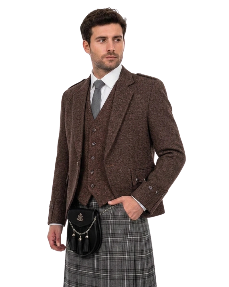 Man wearing a brown tweed jacket, vest, and plaid kilt with a sporran on a white background