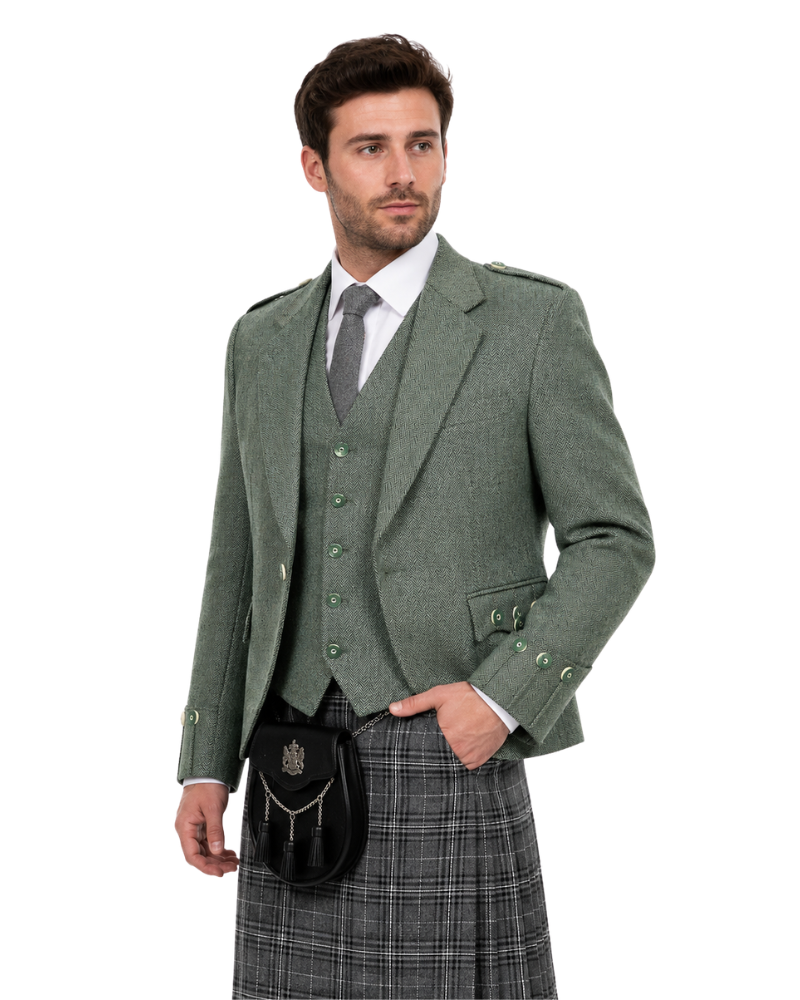 Man wearing a traditional Scottish kilt outfit with a jacket, waistcoat, and tartan skirt on a white background.