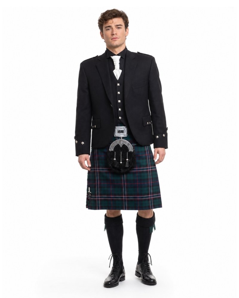 Man wearing a traditional Scottish kilt with a jacket on a white background