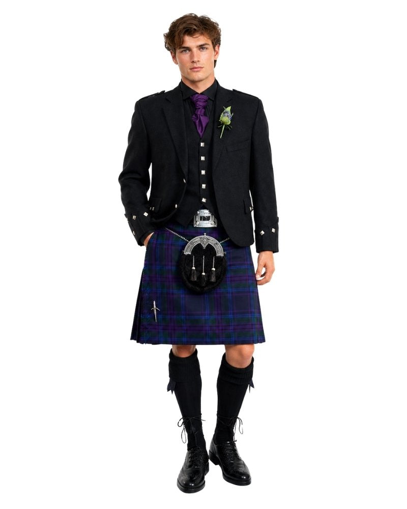 Man wearing a traditional Scottish kilt with a jacket on a white background