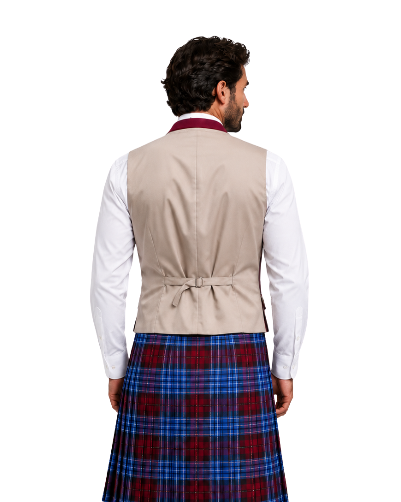 Man wearing a beige waistcoat over a white shirt with a blue plaid kilt on a white background